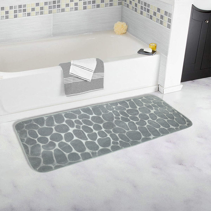 SoftTouch Cobblestone Pattern Memory Foam Bath Mat is machine washable and non-slip, making it a perfect addition to any bathroom. The absorbent polyester material resists stains, making it ideal for use in the bathtub or kitchen. This home decor runner