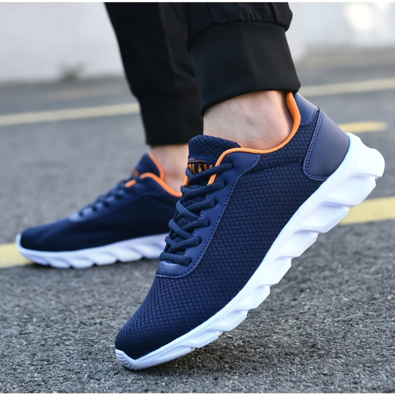 Navy blue mesh sneakers with orange accents, ideal for spring/summer running.