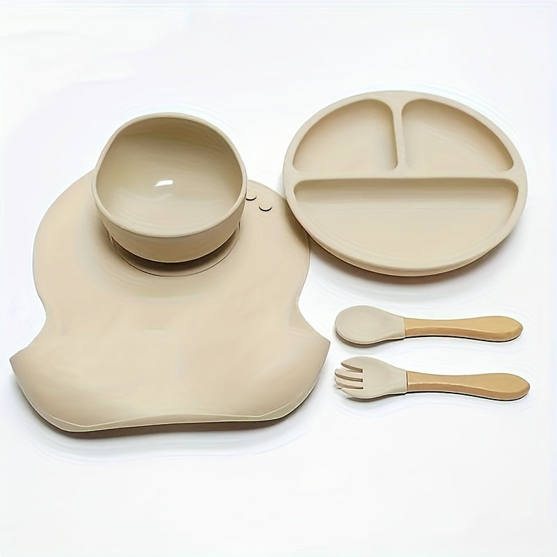 Set of 5 Baby Silicone Tableware including a fork and spoon with wooden handles, silicone bowl, divided plate, and waterproof bib. Conveniently washable and an essential addition to any household.