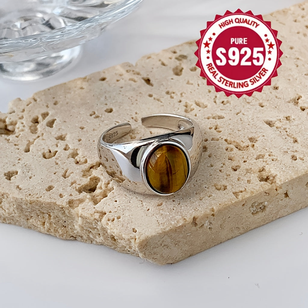 A versatile S925 silver ring adorned with a natural Tiger's Eye stone, offering impeccable quality and intricate design. Perfect for both men and women, showcasing a stunning appearance that is ideal for gifting or wearing on any occasion, whether it be