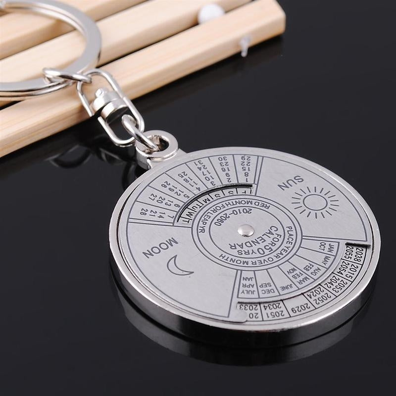 Perpetual calendar keychain with rotating compass. Unique gift for car keys.