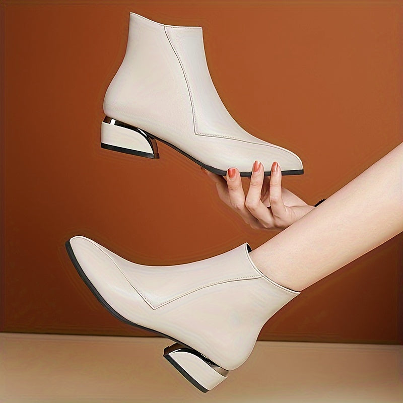 Women's low heeled ankle boots with pointed toe and side zipper, perfect for casual wear.