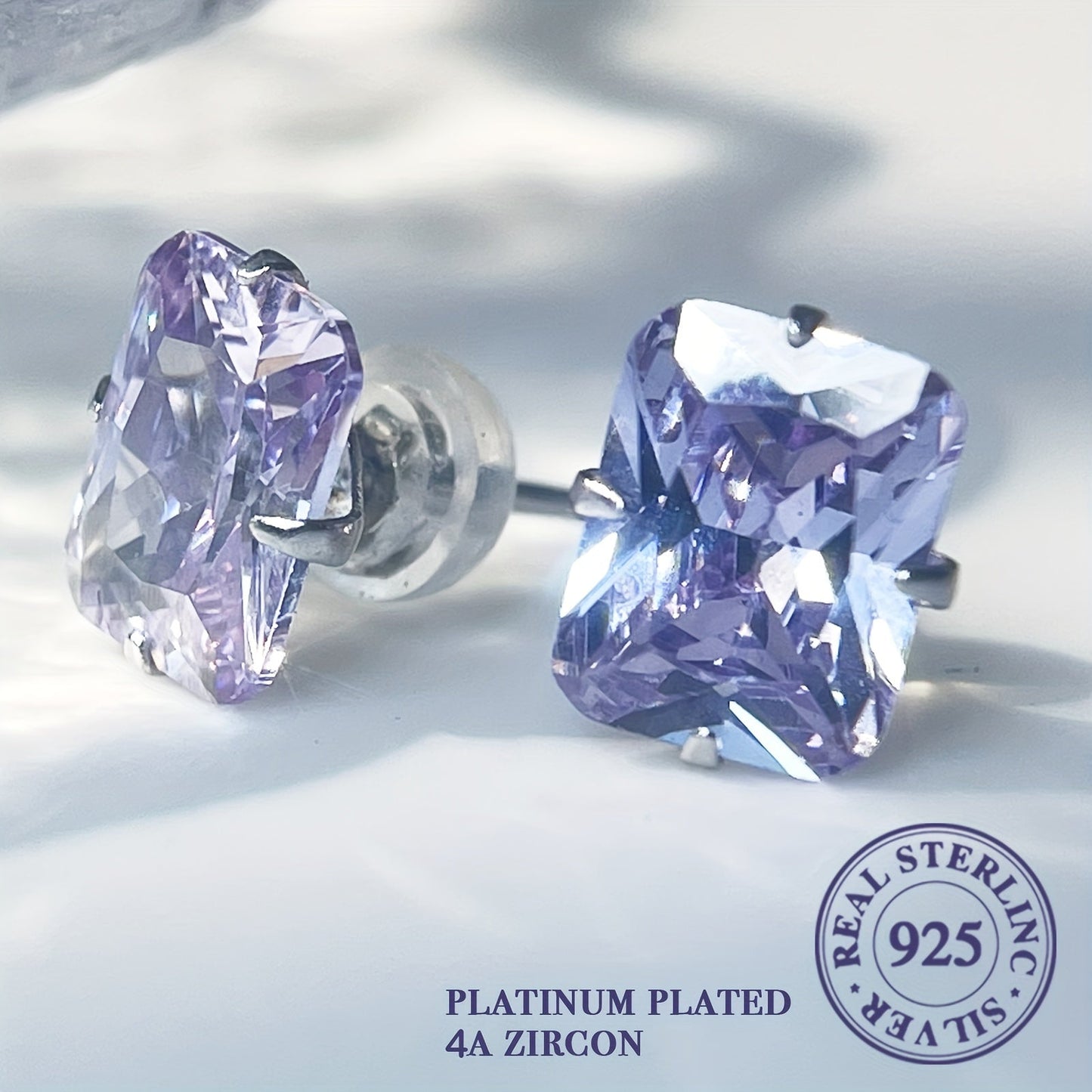 'These refined rectangular stud earrings in 925 sterling silver feature a lovely light purple and blue hue. Versatile for everyday wear and special occasions, they make an ideal Valentine's gift.'