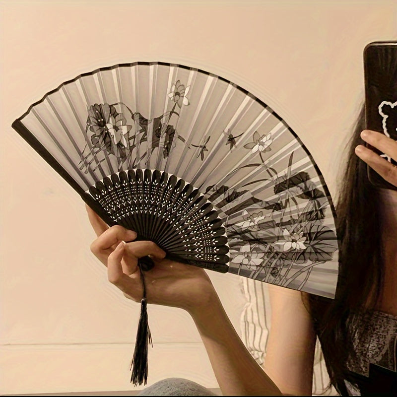 Asian-inspired bamboo hand fan with plant design - perfect for home decor, dance, or as a gift.