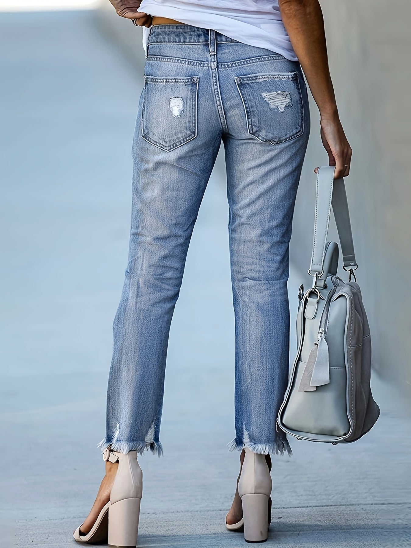 Elegant women's denim jeans with solid color, high elasticity, mid-rise waist, straight fit, 9-inch length, zipper closure, and pockets - perfect for any season and going out.