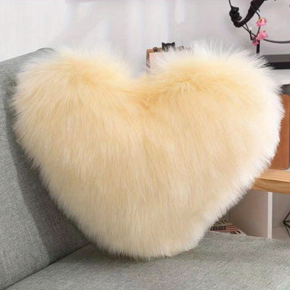 Heart-shaped throw pillow for living room or bedroom, made of long plush material for softness and comfort.