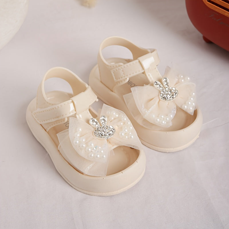 New 2024 baby girl sandals with anti-kick feature, cute rabbit design, and soft soles for beach.