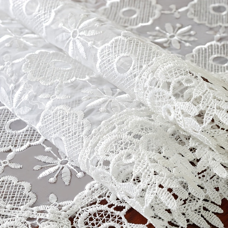 Polyester table runner with white embroidery flowers and lace edge, perfect for room or dining table decor.