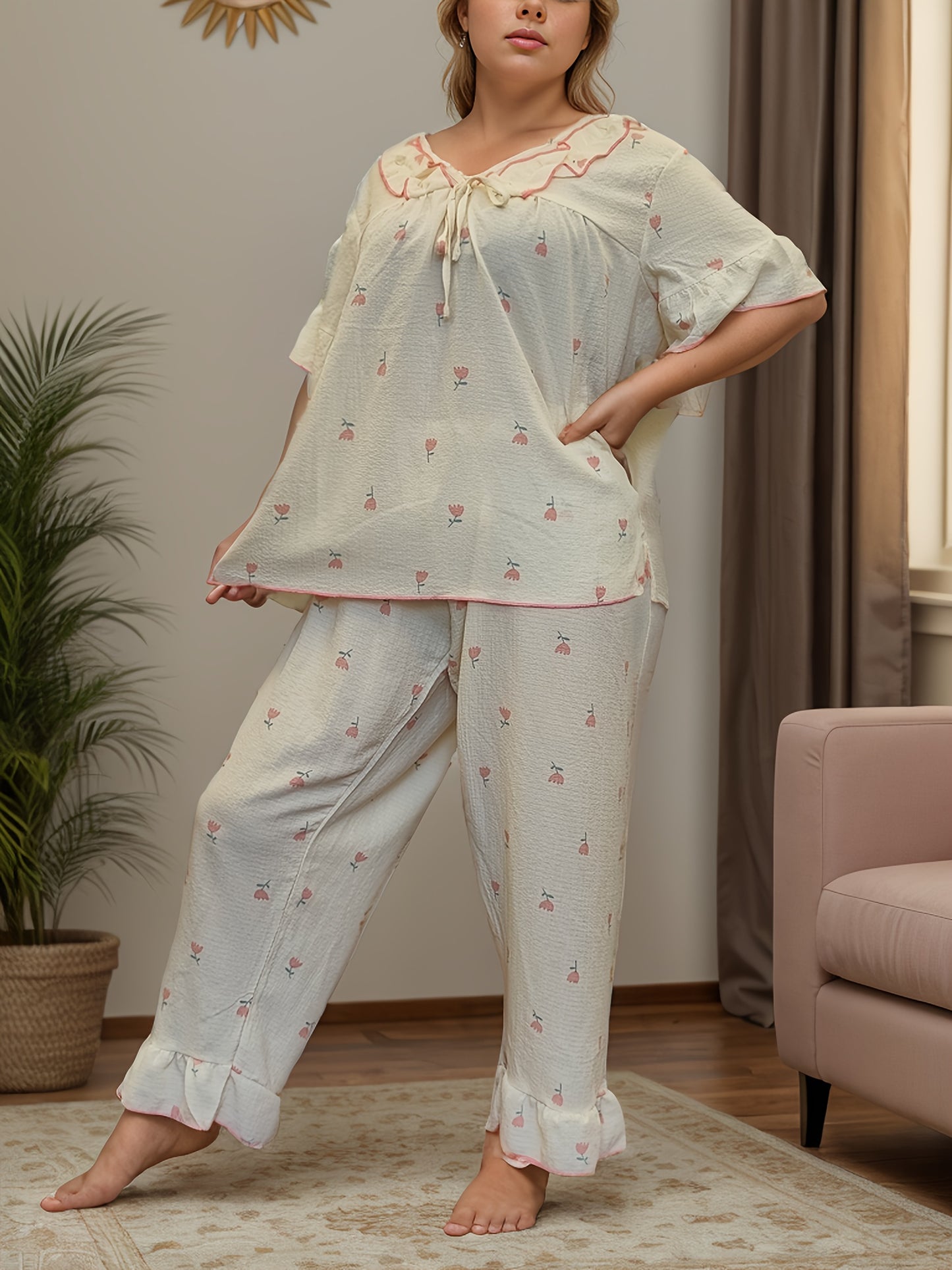 Women's printed pajama set with long pants and short sleeves in large size.