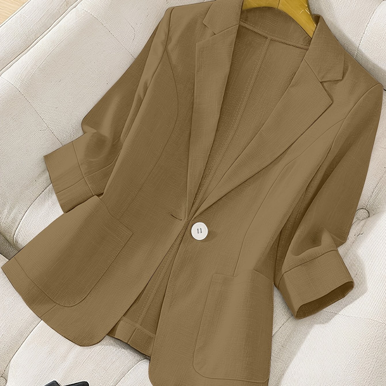 Women's lime green fashion blazer is single-breasted and made of lightweight polyester. Features a classic collar, two flap pockets, and a straight cut for spring/summer elegance.