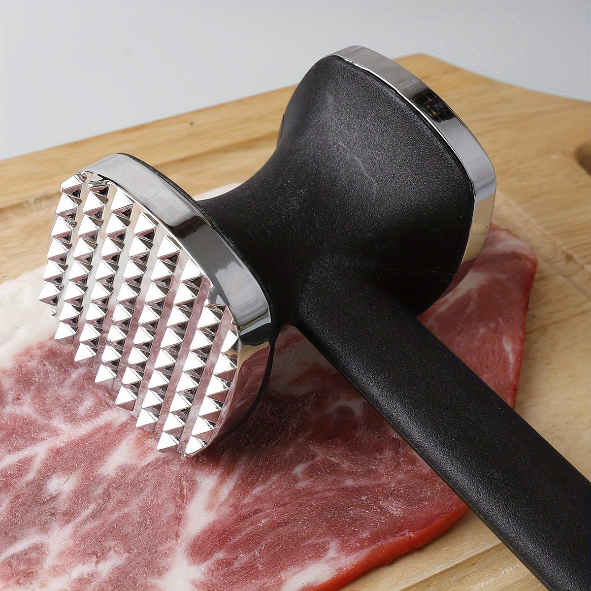 One piece of Zinc Alloy Meat Hammer, a versatile Metal Meat Pounder for household use. This Meat Tenderizer Tool is perfect for knocking meat into tender perfection in the kitchen. Also known as a Meat Tenderizer Hammer, it is a must-have among Kitchen