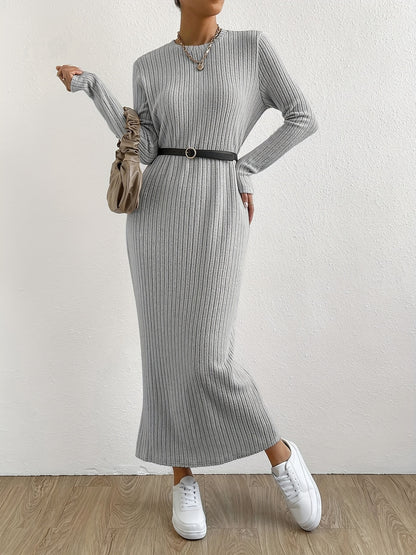 Elegant crew neck striped knit t-shirt dress made from a polyester and spandex blend. Features long sleeves and full-length ribbed knitwear for spring/fall.