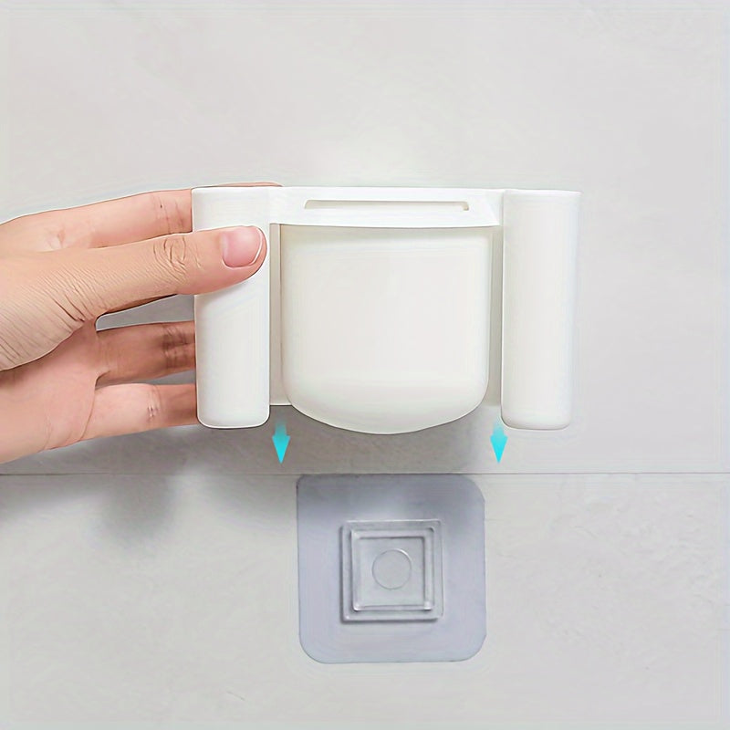 Wall-mounted toothbrush holder for bathroom storage and organization.