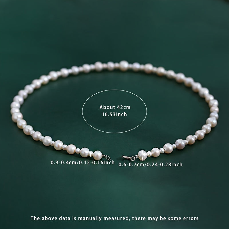 Add a touch of elegance to your look with the MUFAN Freshwater Pearl Necklace for Women. Featuring a luxurious and simple design with a S925 silver clasp, this necklace is perfect for any occasion, from weddings to daily wear. The June birthstone adds a