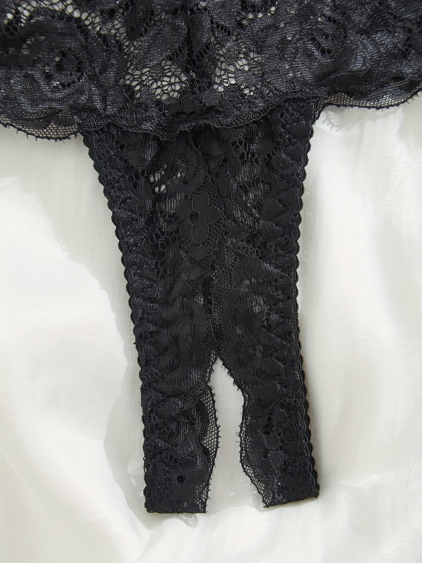 Women's lace lingerie set with open crotch briefs.