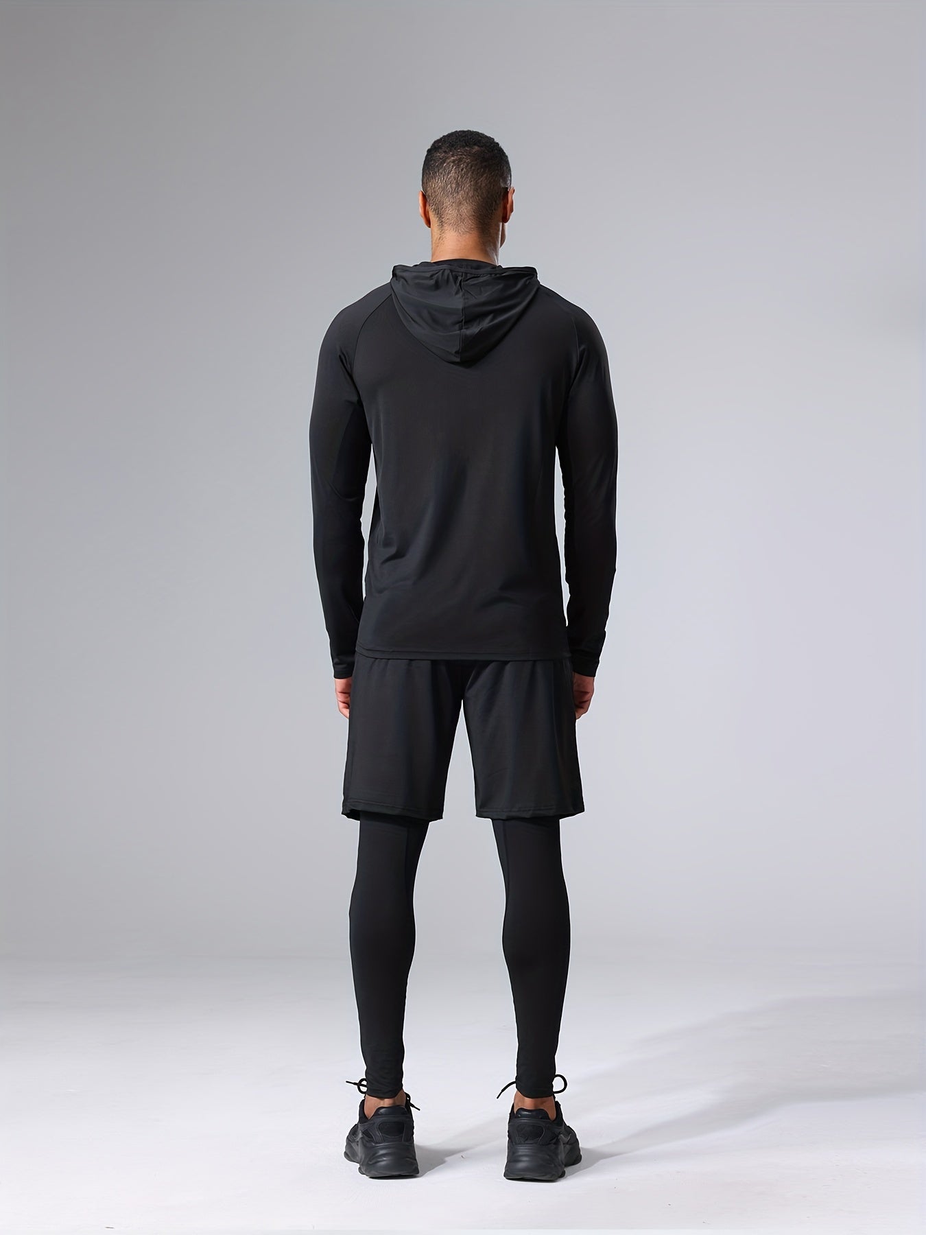 Polyester and elastane blend athletic set includes crew neck hoodie and skinny fit bottoms for running, fitness, cycling, and outdoor activities.