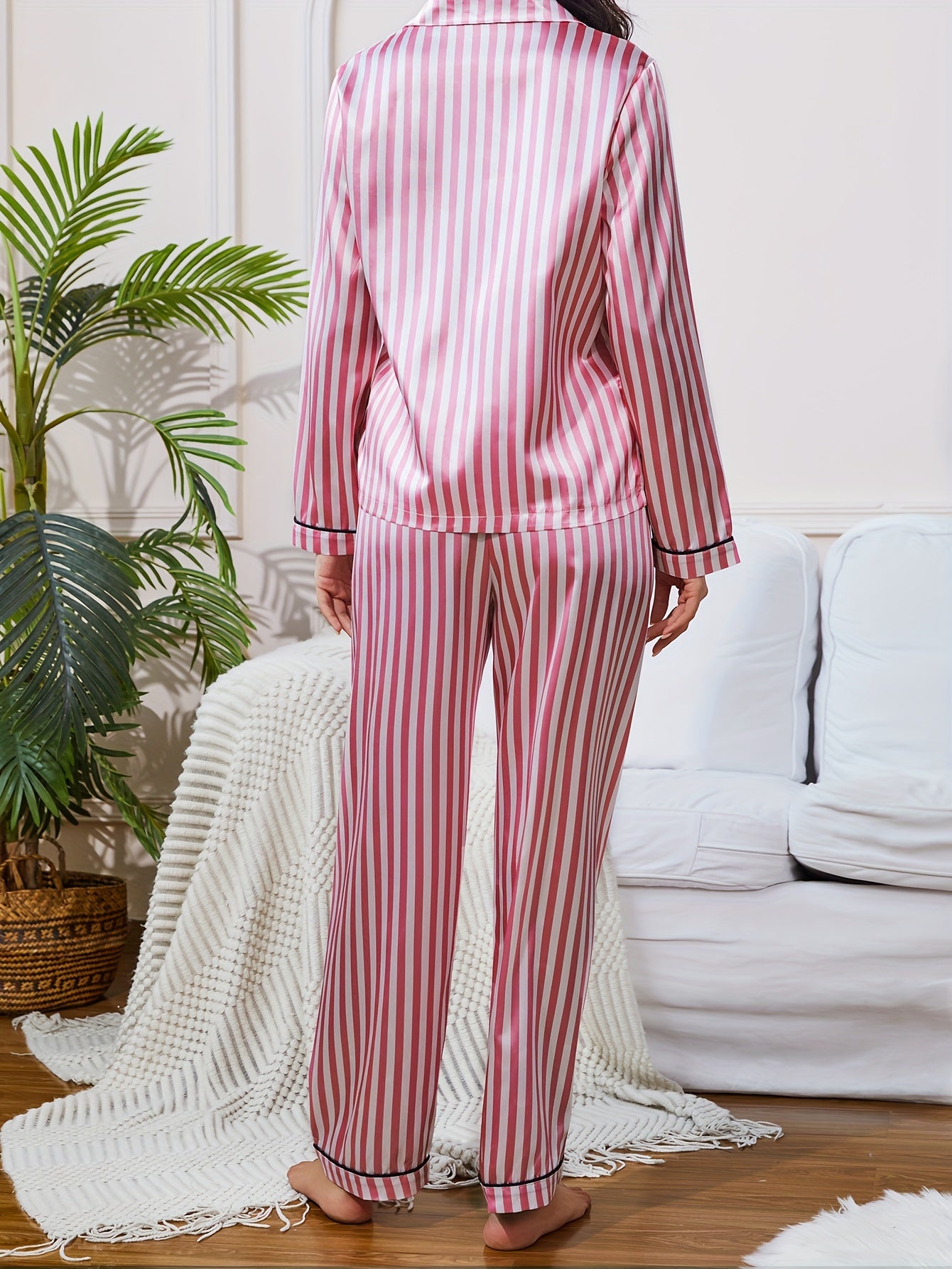 Striped satin pajama set for women with button-up top, long pants, tie waist, and long sleeves for casual sleepwear.