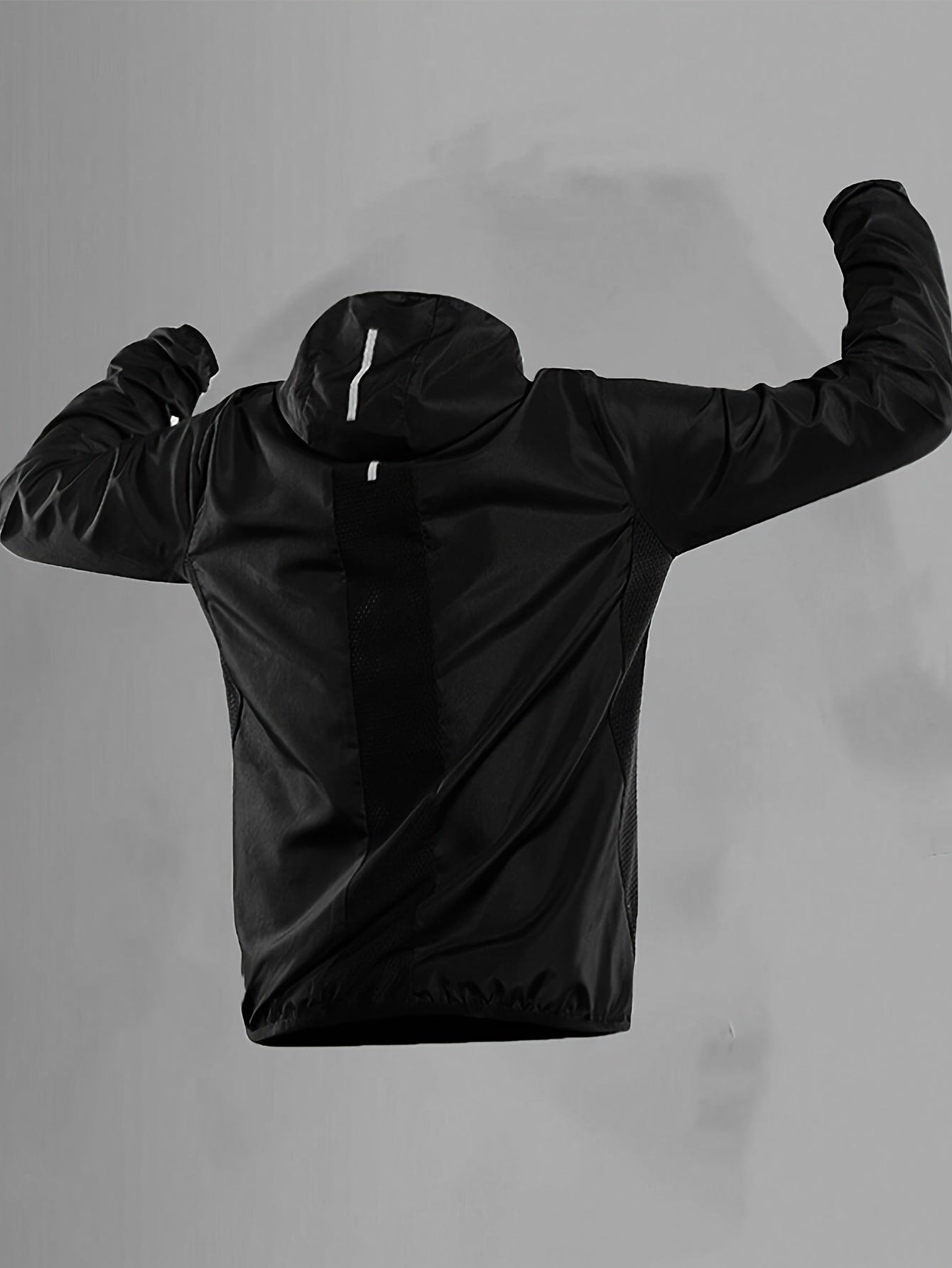 Men's lightweight windproof hooded jacket with reflective straps and mesh panels, ideal for outdoor activities. Features geometric pattern, made from woven fabric with 92% polyamide and 8%