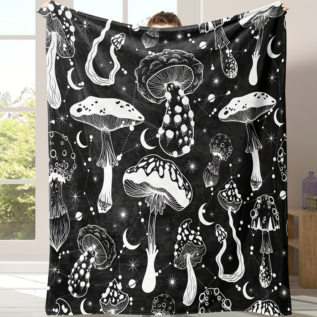 Stay cozy with this stylish Black and White Mushroom Patterned Flannel Blanket, perfect for naps, snuggling, or keeping warm. This versatile and lightweight blanket is a great gift for the home, providing comfort in the living room, bedroom, office, or