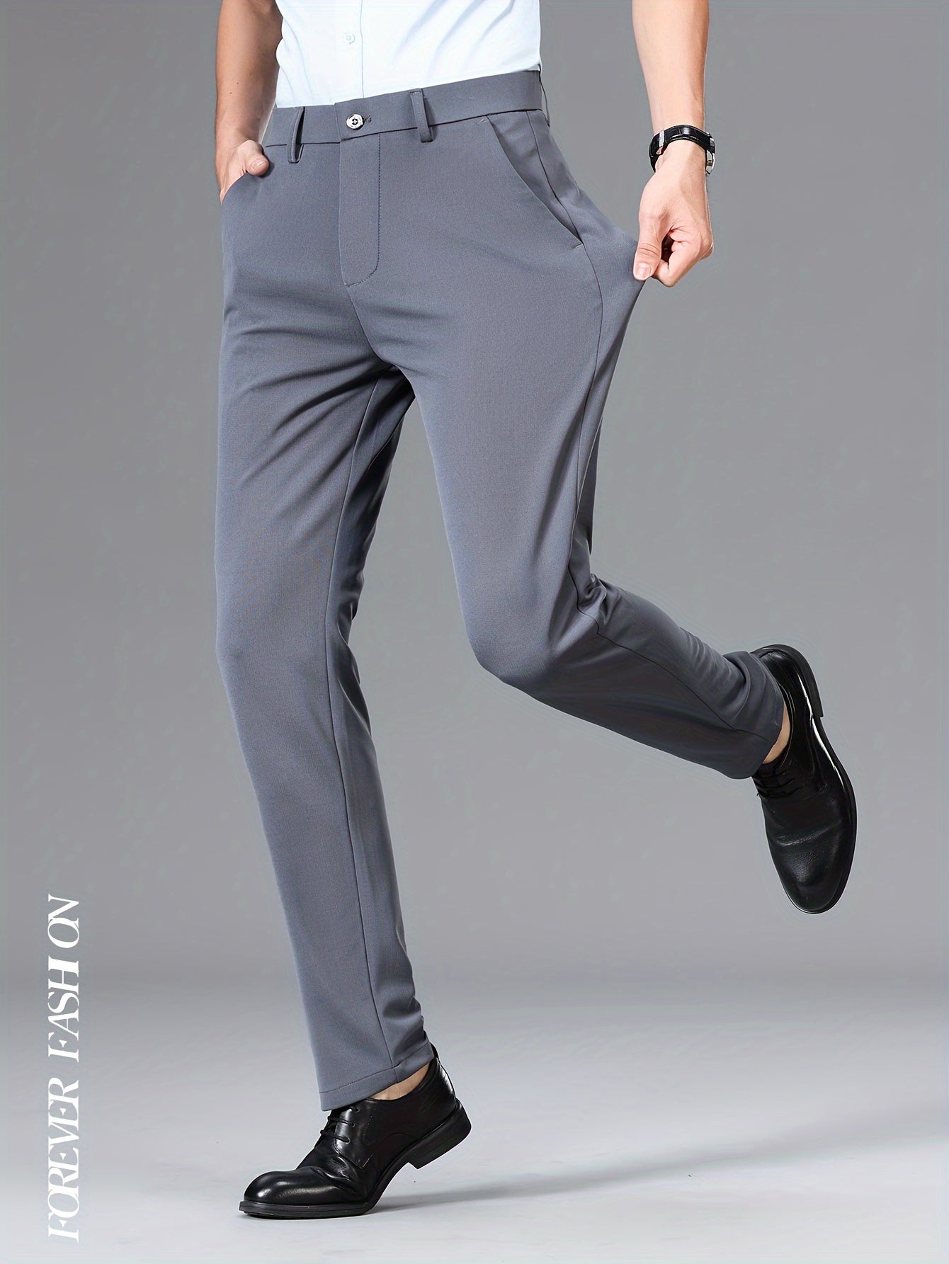 Stretchy black dress pants with bird emblem for men, slim fit, machine washable for business casual and social events.