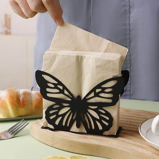 A single piece of the butterfly-shaped tissue dispenser, made of metal, ideal for holding napkins on kitchen countertops or dining tables as a elegant home decoration.