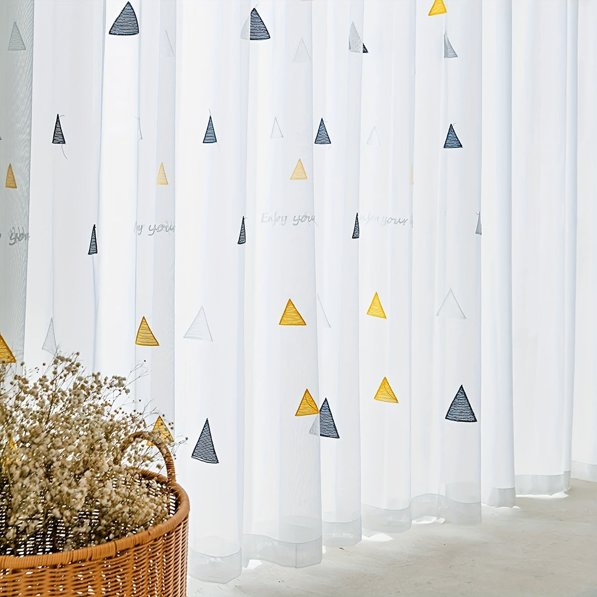 Modern geometric triangle sheer curtains in white polyester with an arts & crafts theme, suitable for girls room, living room, or bedroom. Machine washable, unlined, and featuring a decorative rod pocket embroidered panel.