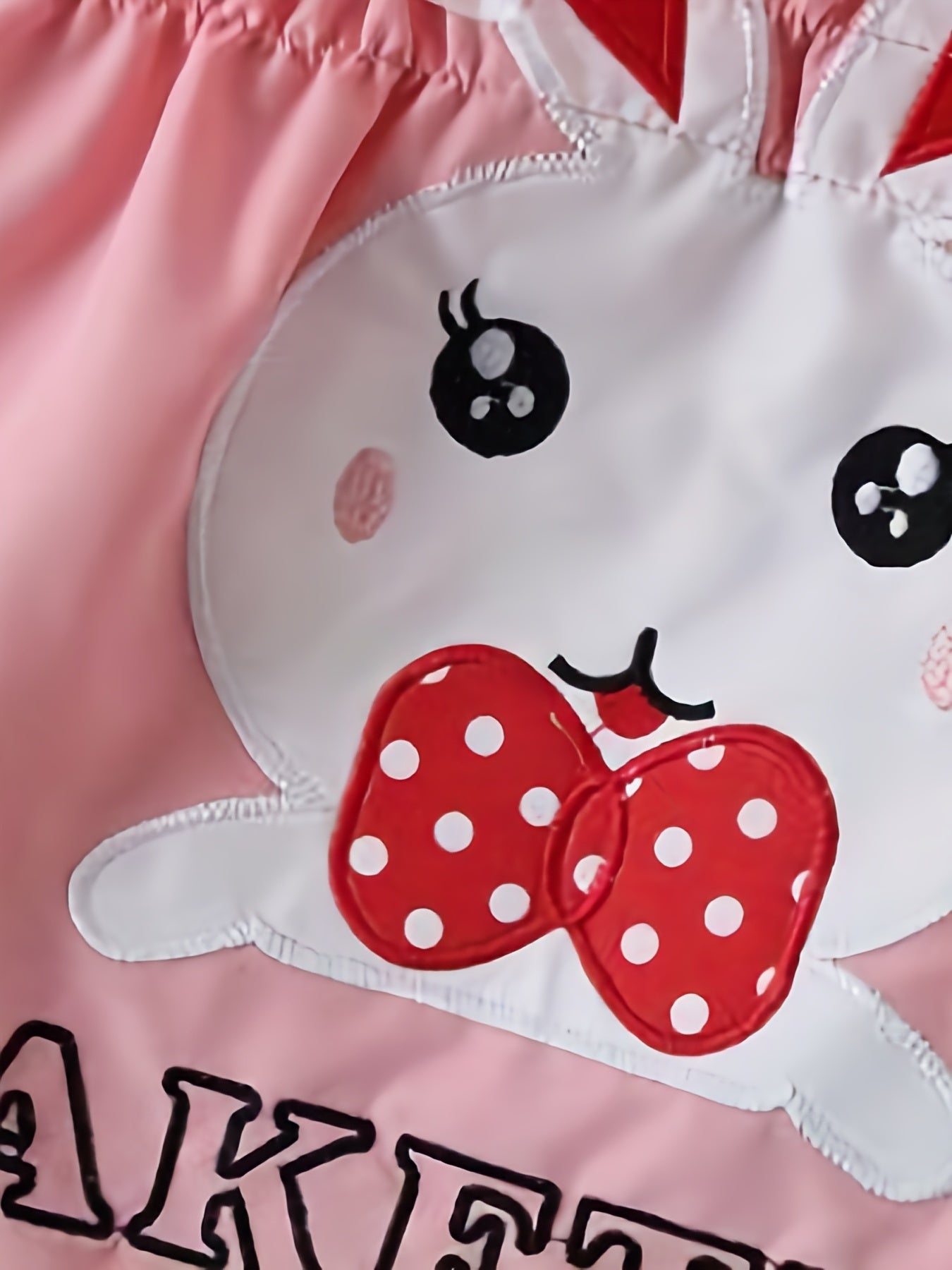 Girls' cute bunny-themed windbreaker in light pink, long sleeve, polyester blend, non-stretch fabric with pockets. Ideal for spring and autumn.