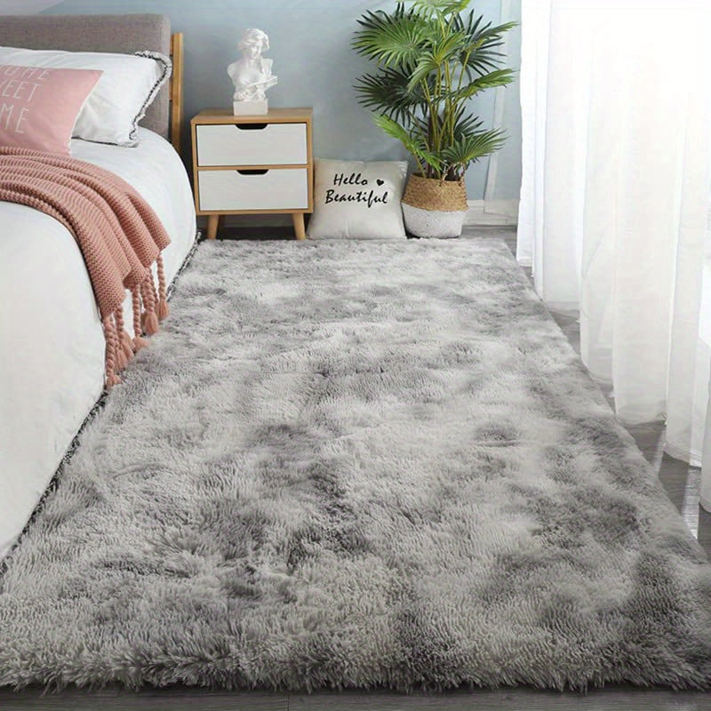 Soft, fluffy shag area rug perfect for living room or bedroom decor. This non-slip machine washable carpet adds luxury and coziness to any space.