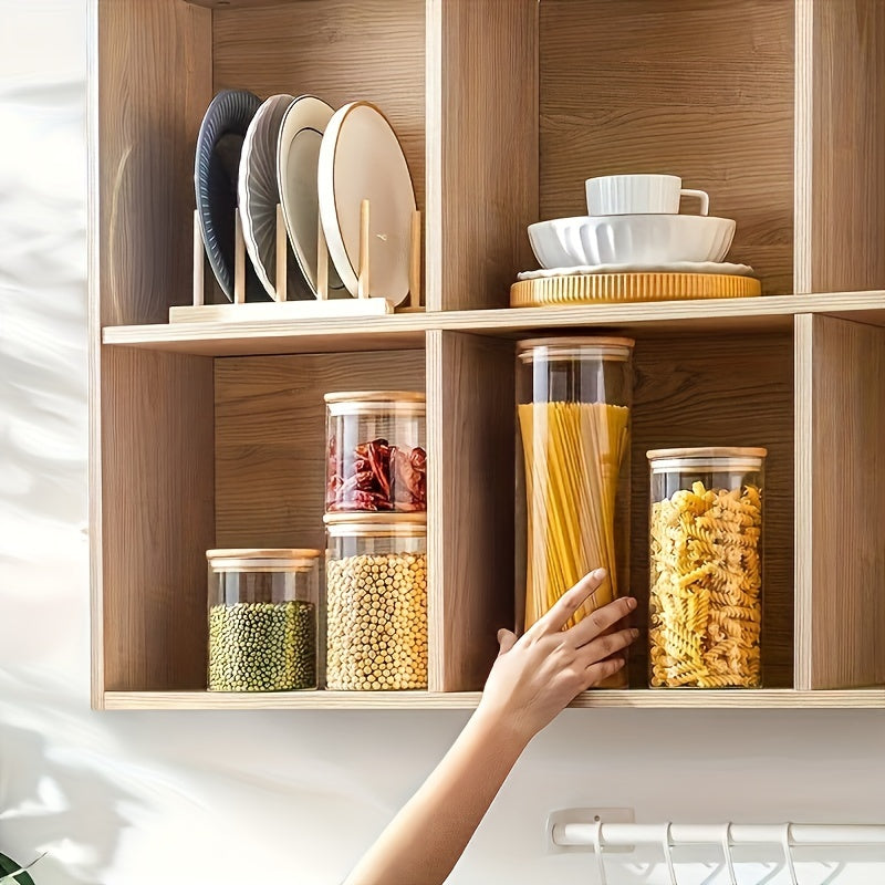 Set of 5 glass food storage jars with bamboo lids, perfect for storing dry goods such as pasta, tea, and nuts. These airtight kitchen canisters are made from high borosilicate glass with a large capacity. No electricity is needed to use these food-safe