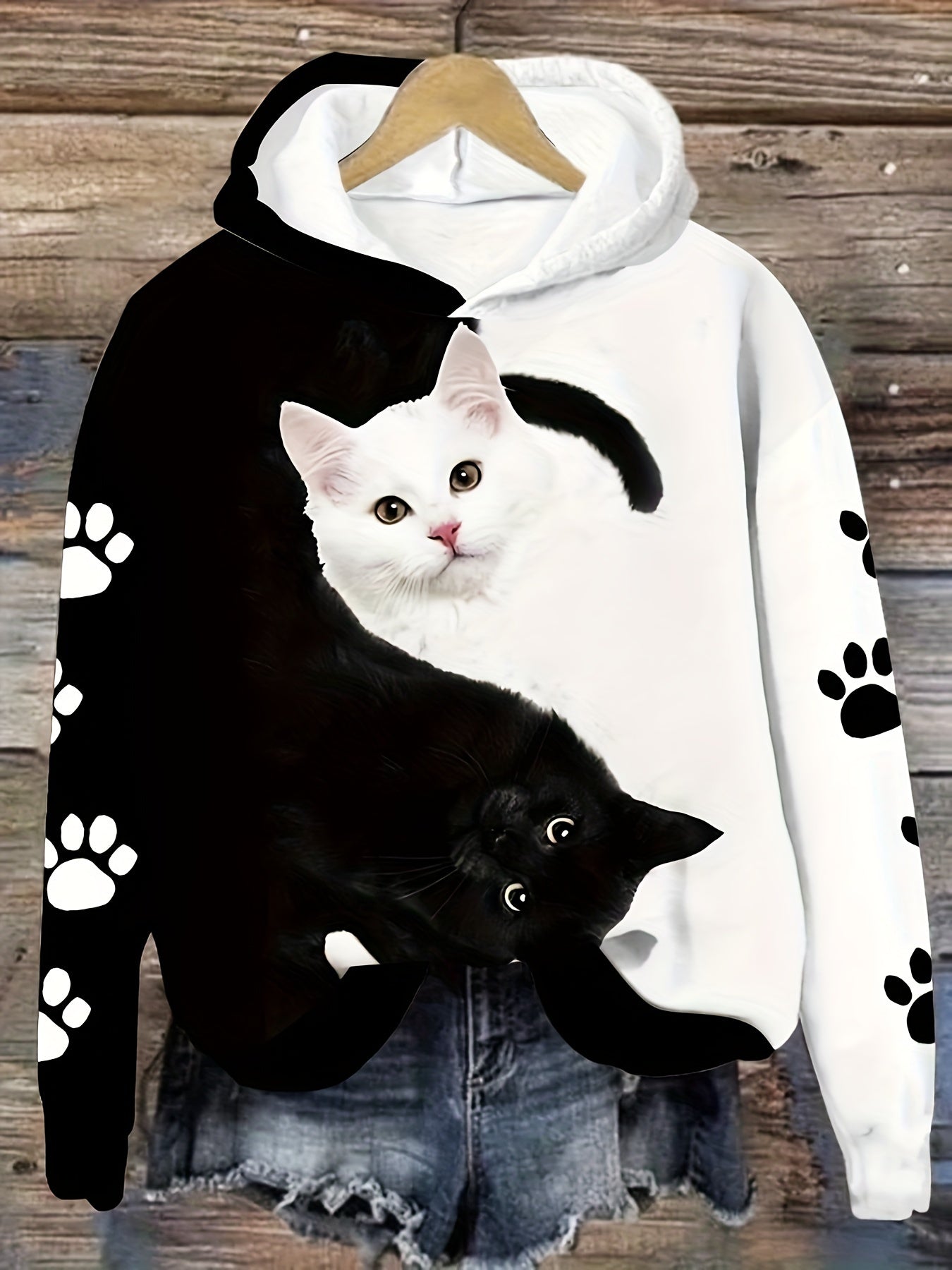 Cozy cat print hoodie for women, with kangaroo pocket, made of machine washable polyester blend.