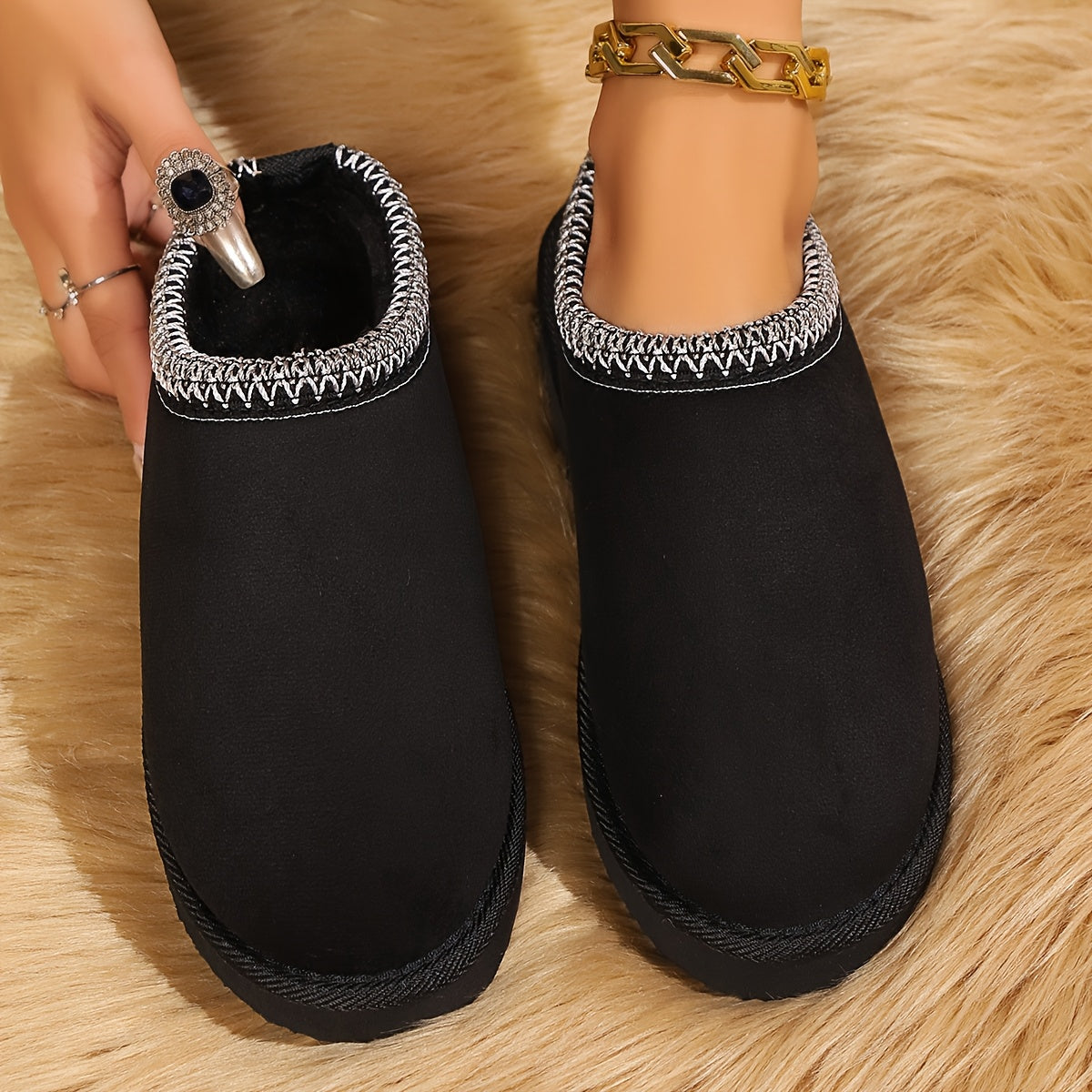 Warm and cozy women's winter slippers with plush lining and anti-slip sole.