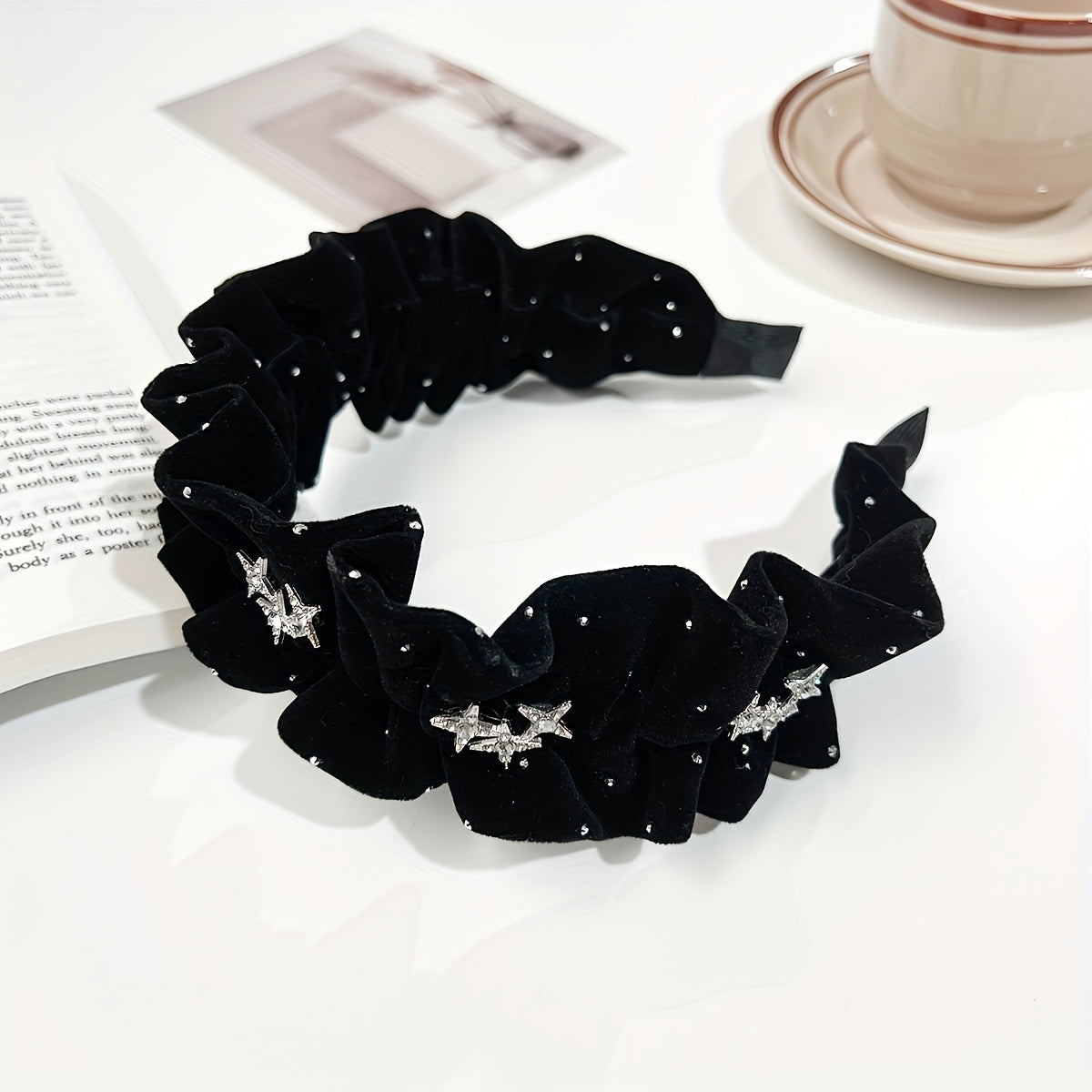 Black velvet headband with rhinestone embellishments, ideal for weddings and formal events.