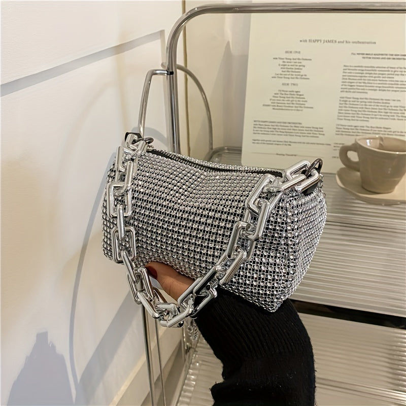 Metallic evening bag with chain strap, zip closure, and polyester lining in silver grey - a stylish accessory for women.