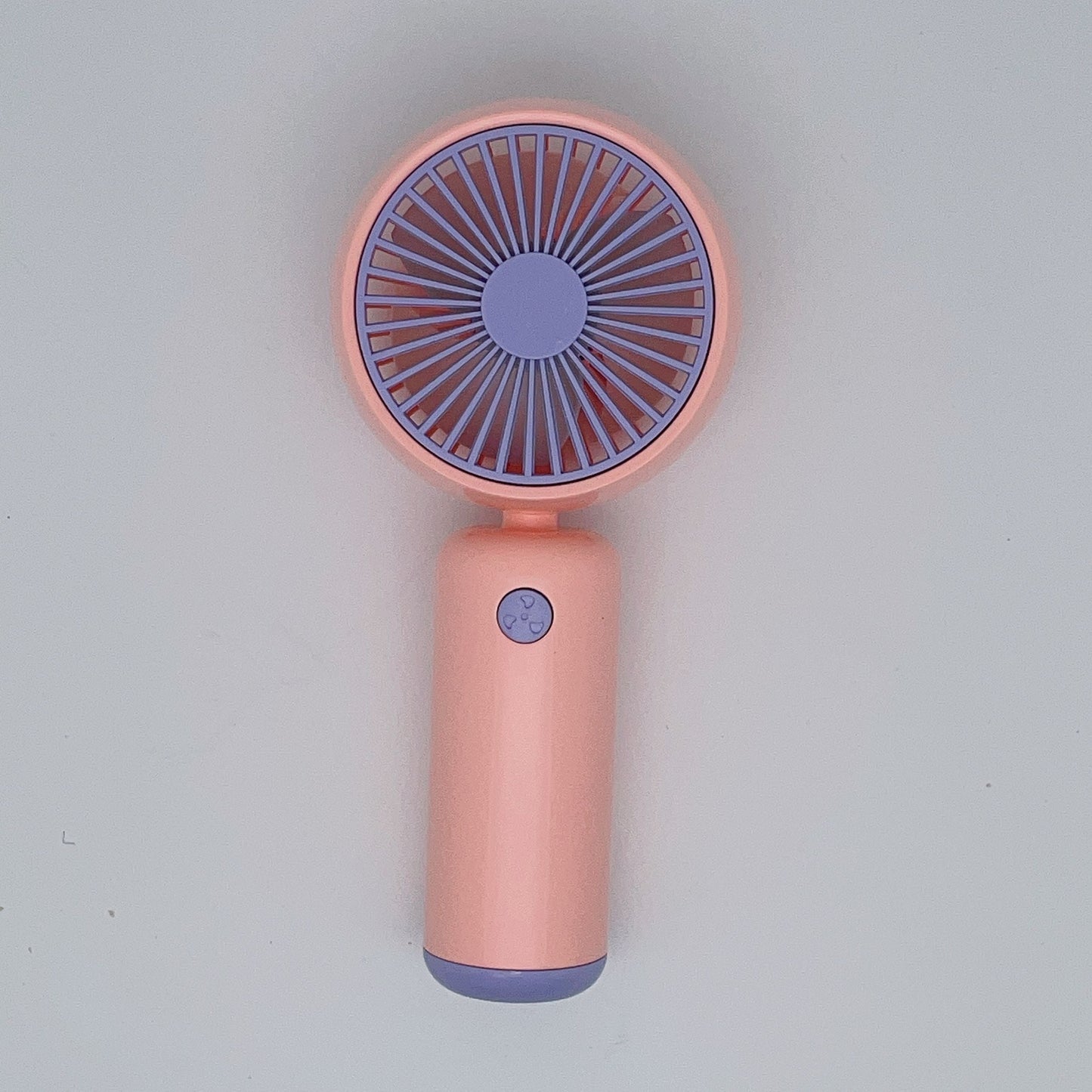 Small handheld portable fan with USB rechargeable battery, three adjustable speeds, and wearable design for use both indoors and outdoors.