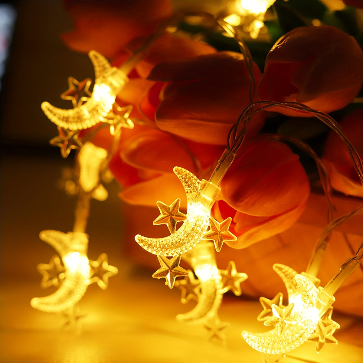 Battery powered star and moon light string for home decor, suitable for various festive decorations.