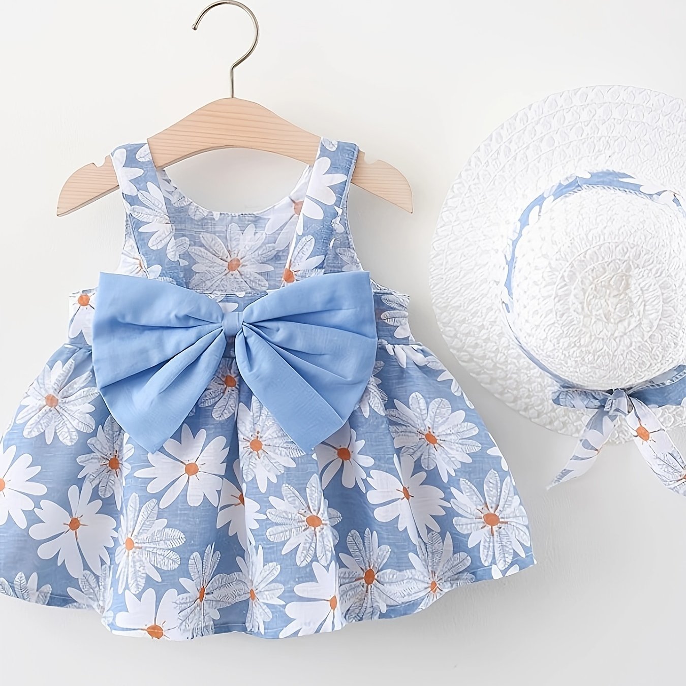 Summer dress with flower print, big bow, and matching hat set for baby girls.