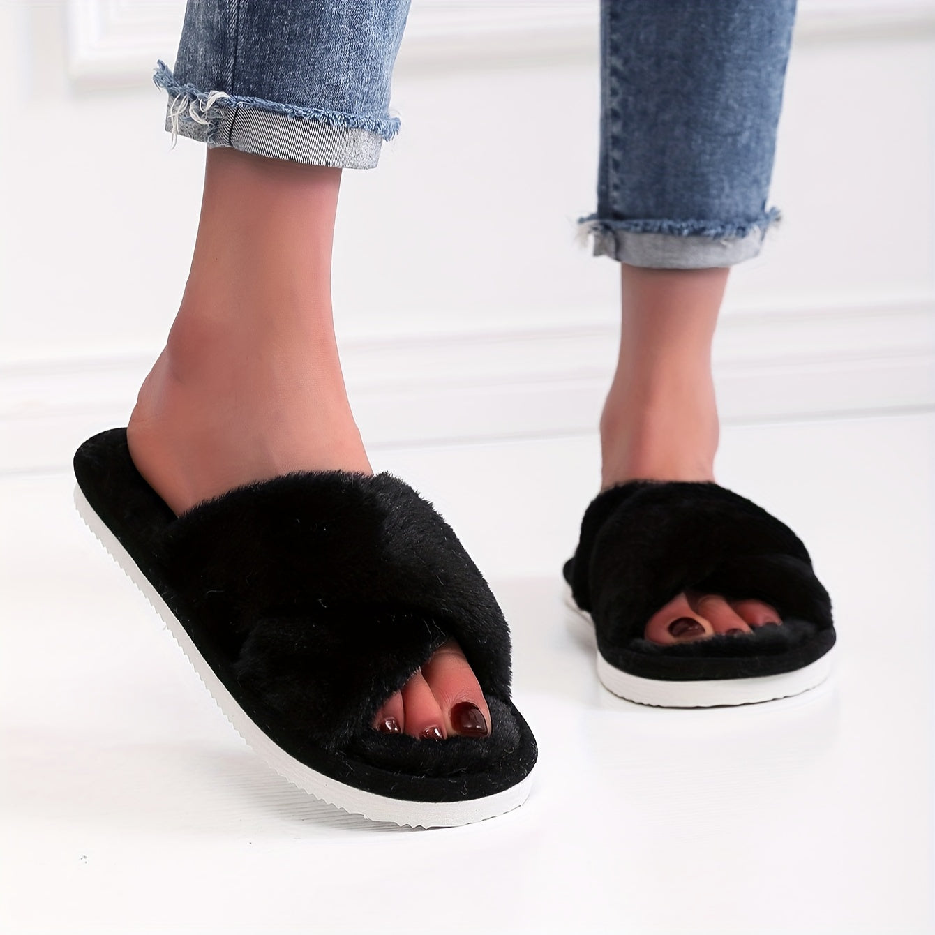 Plush cross-strap slippers for cozy indoor comfort.