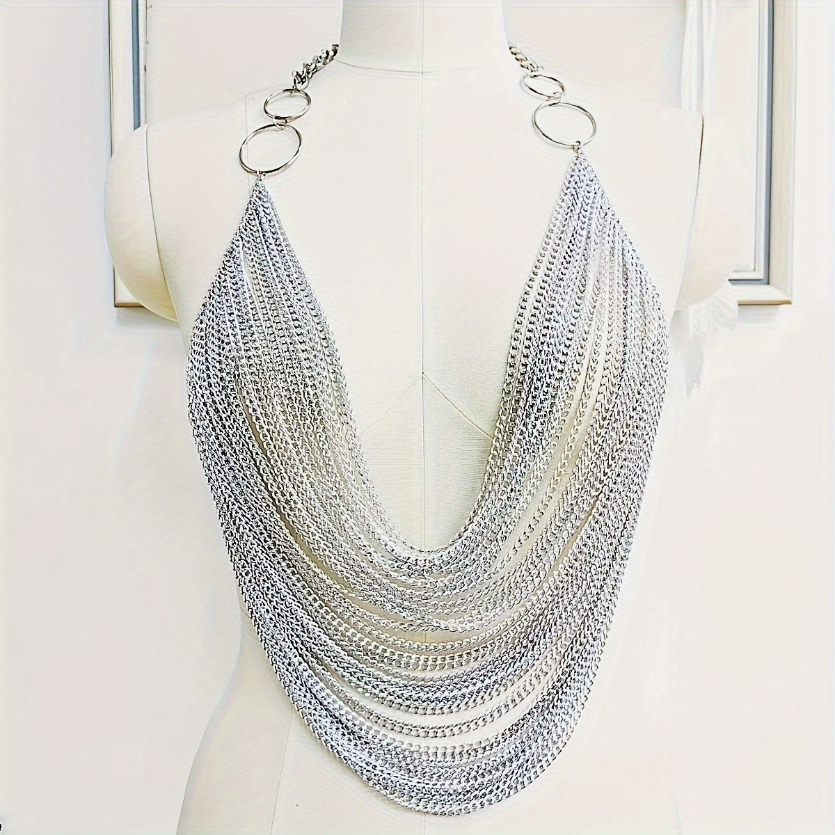 The Y2K Hanging Silvery Body Chain is perfect for music festivals and street rock fashion.