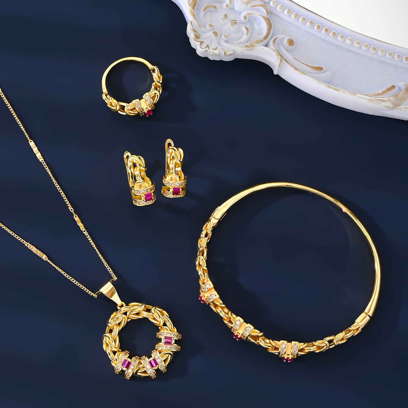 Luxurious Dubai-inspired jewelry set crafted with simple brass material and 18k Gold Plating, adorned with Zirconia stones. This elegant 5-piece set includes a necklace, earrings, bracelet, and ring, perfect for daily wear or as a special gift. The Retro