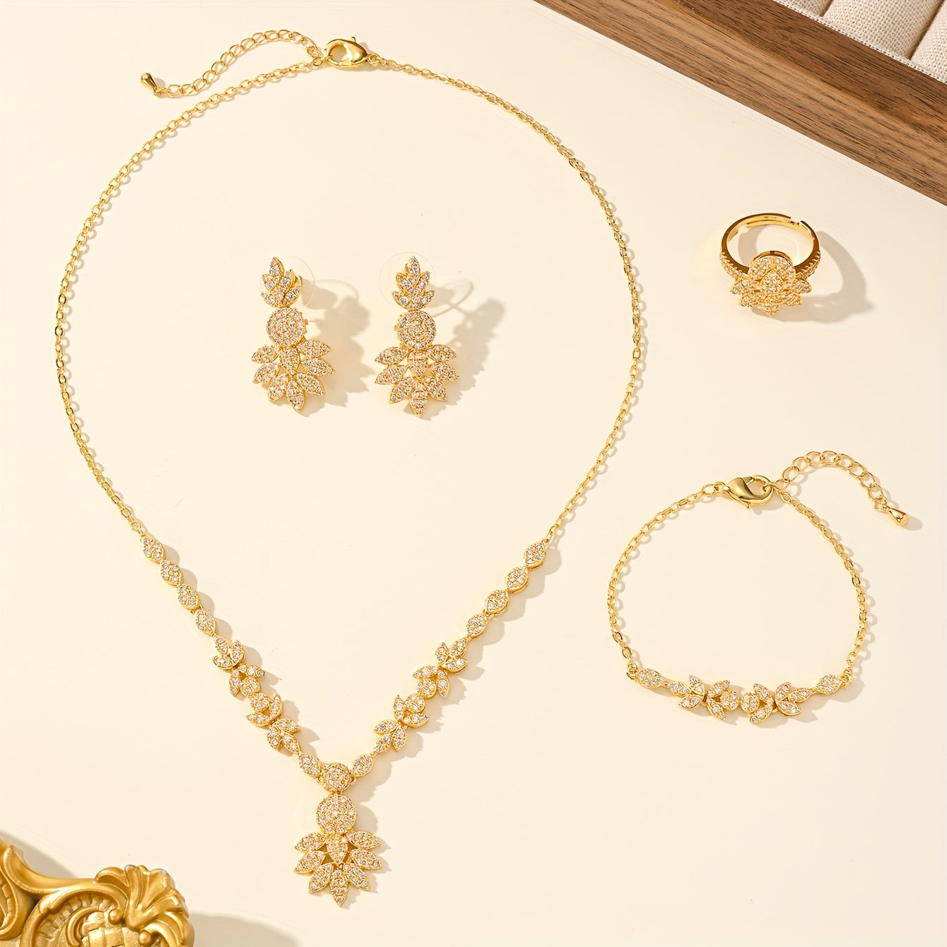 Luxurious 5-piece Jewelry Set for Women, Featuring 18K Gold-Plated Copper adorned with Synthetic Zirconia Stones in a Stunning Floral Design. Includes Necklace, Earrings, Bracelet, and Ring, Perfect for Everyday Wear or Special Wedding Occasions.