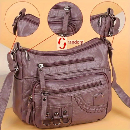 Casual black crossbody bag with multiple zippers for daily use.