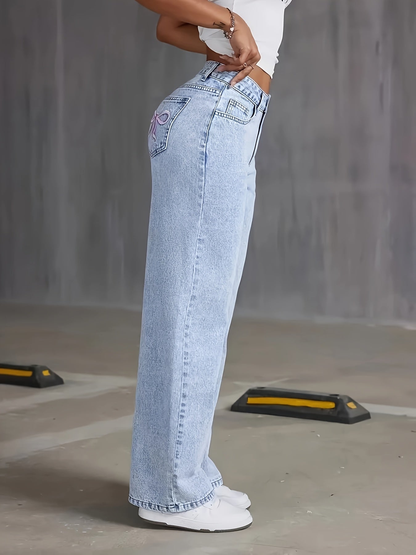 High-rise light wash blue denim wide-leg pants with butterfly details - street style, non-stretch fabric, machine washable.