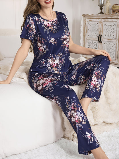 Women's floral print pajama set with short sleeve round neck top and elastic pants for casual wear.