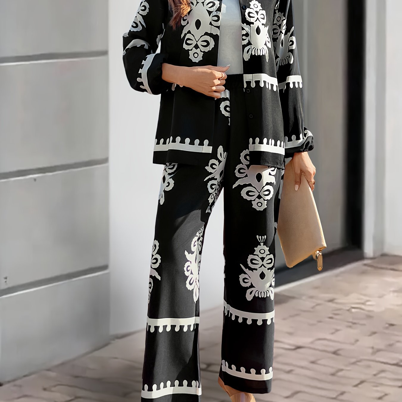 Women's 2-piece casual suit made of 100% polyester, featuring a long sleeve top with button front and pants with plant pattern. Loose fit with cardigan collar and regular sleeves, suitable