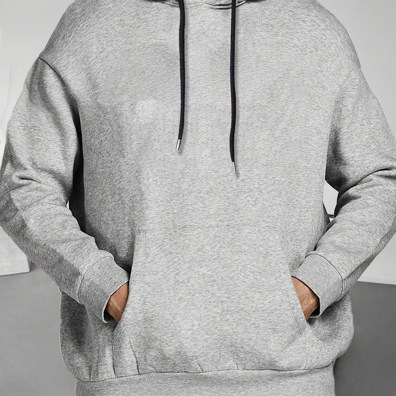 This men's long-sleeve hoodie is cozy and versatile, perfect for outdoor activities in autumn, spring, and winter. It pairs well with a hip-hop necklace and makes a great gift for plus-size