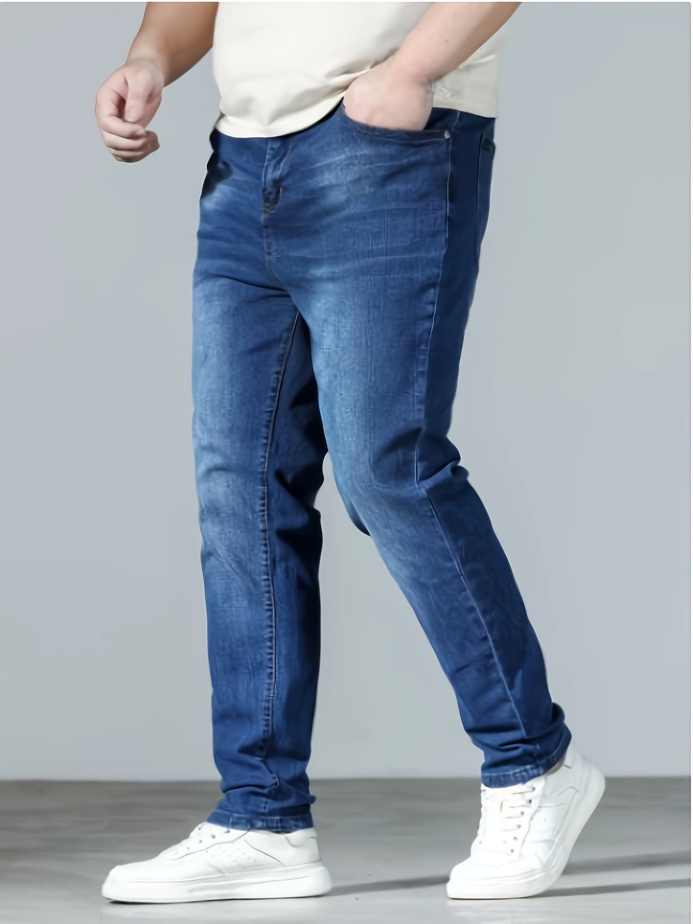 Plus size men's casual skinny fit denim jeans with medium stretch, solid color, pockets, suitable for all seasons.