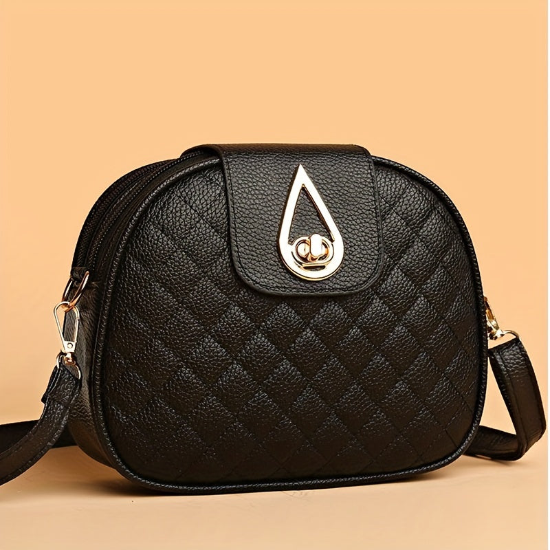 Vintage style faux leather crossbody bag in black with quilted design, adjustable strap, and phone pocket.