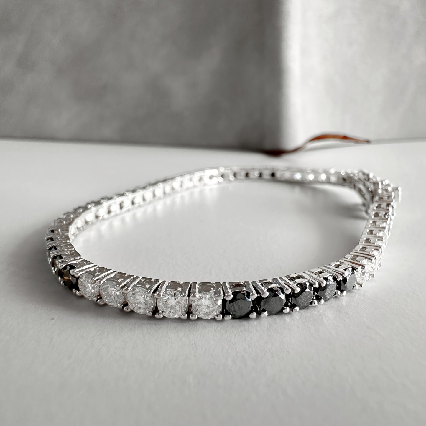 One piece of an elegant and luxurious tennis link bracelet, featuring S925 silver plating with black and white Moissanite stones. Each stone is 0.1 carats, creating a fashionable and personalized piece of jewelry perfect for parties, banquets, holidays