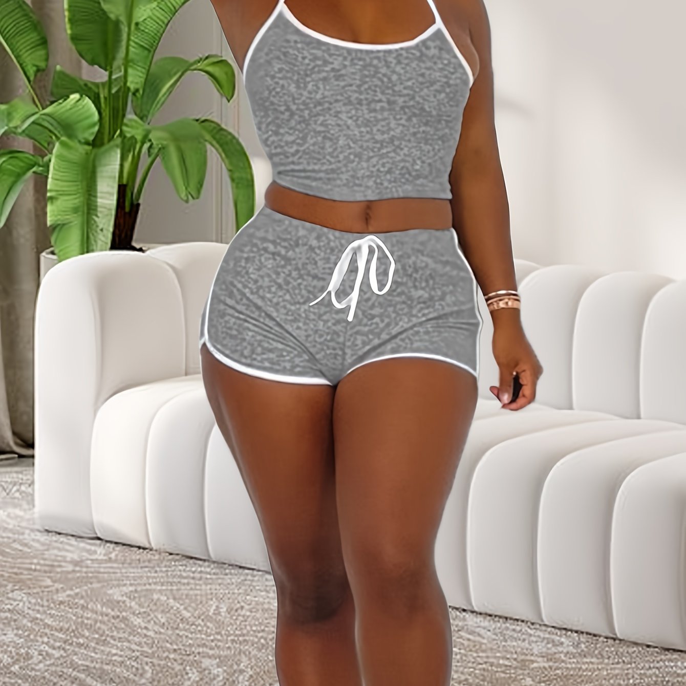 Stylish lounge set with halter neck crop top and elastic shorts for women's sleepwear.