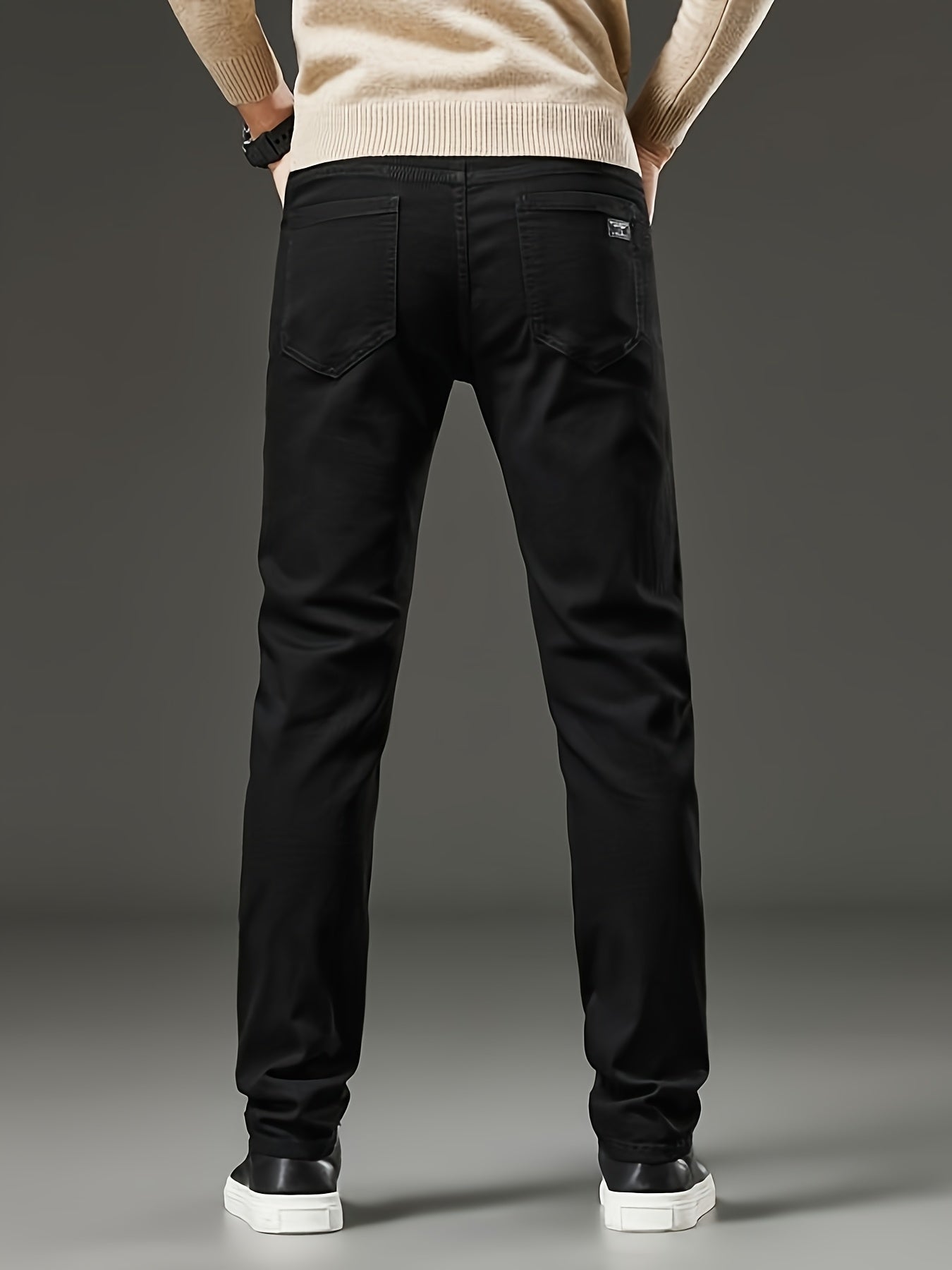 Slim fit men's jeans made of stretch denim in a solid color with washed details, suitable for year-round wear.